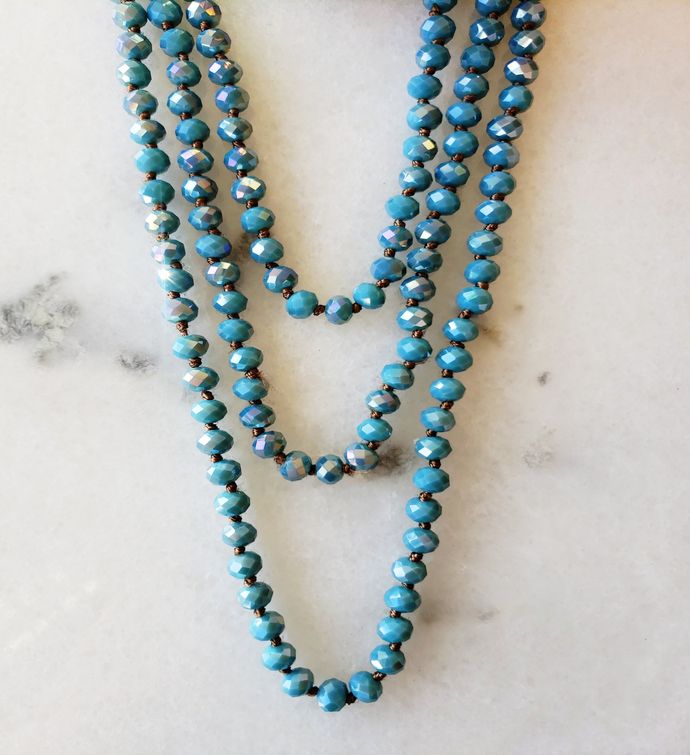 Iridescent Air Force Blue Necklace Delicately Spaced With Decorative Knot